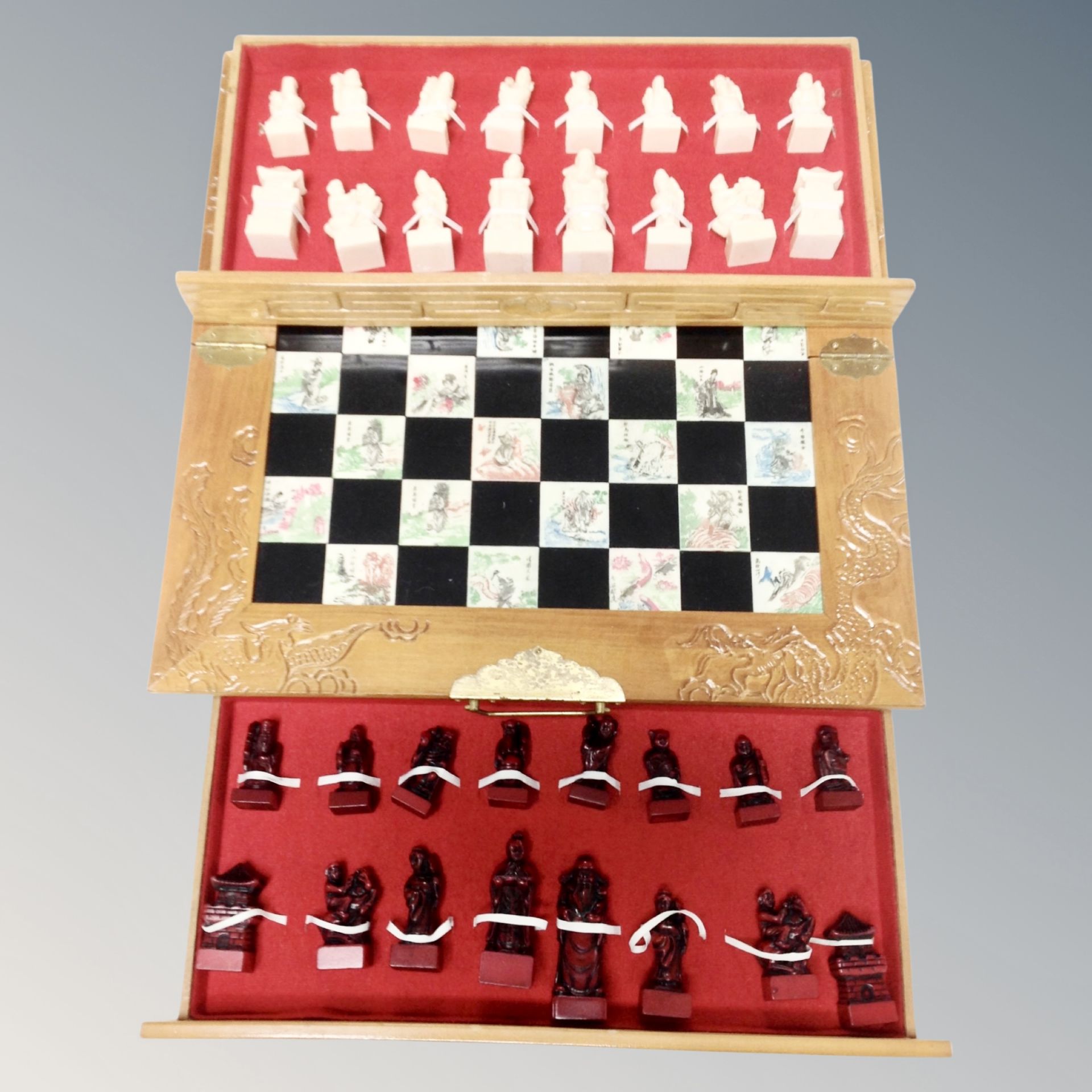 A Chinese style folding chess board with pieces
