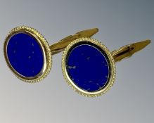 A pair of lapis lazuli cufflinks set in 14ct yellow gold.