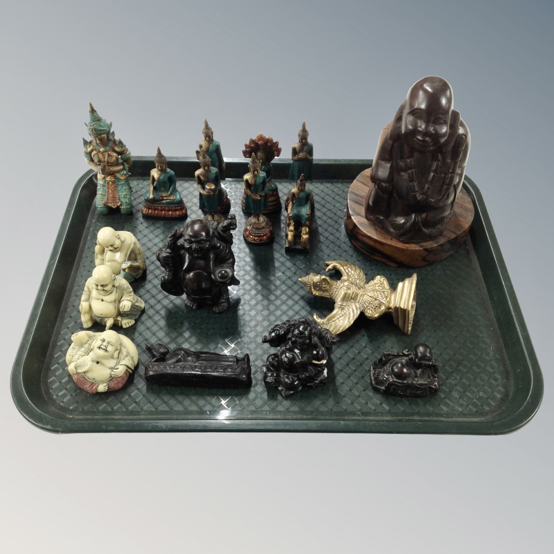 A tray of resin carved wooden brass and patinated metal Buddha and Eastern figures