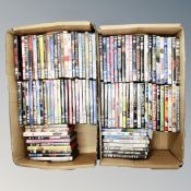 Two boxes containing approximately 100 dvds