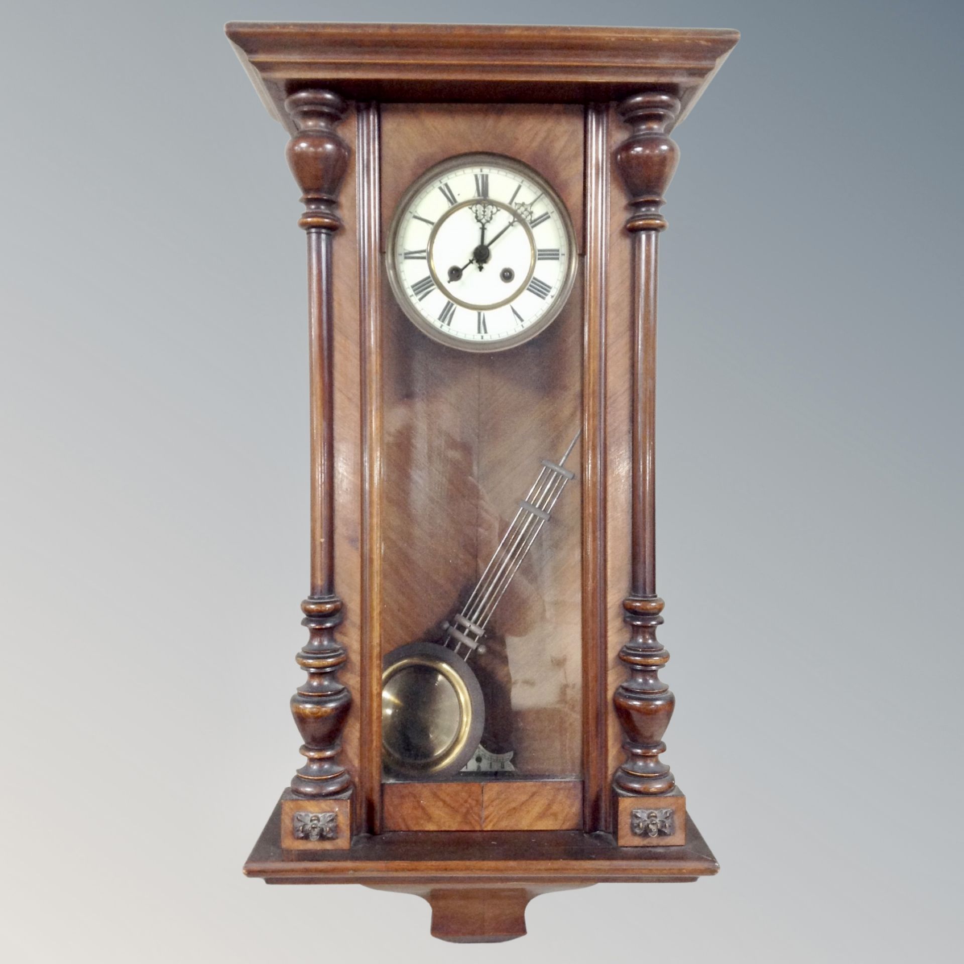 A walnut cased Vienna wall clock