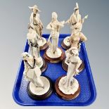 A tray of seven Leonardo Collection Art Deco style figures on wooden stands