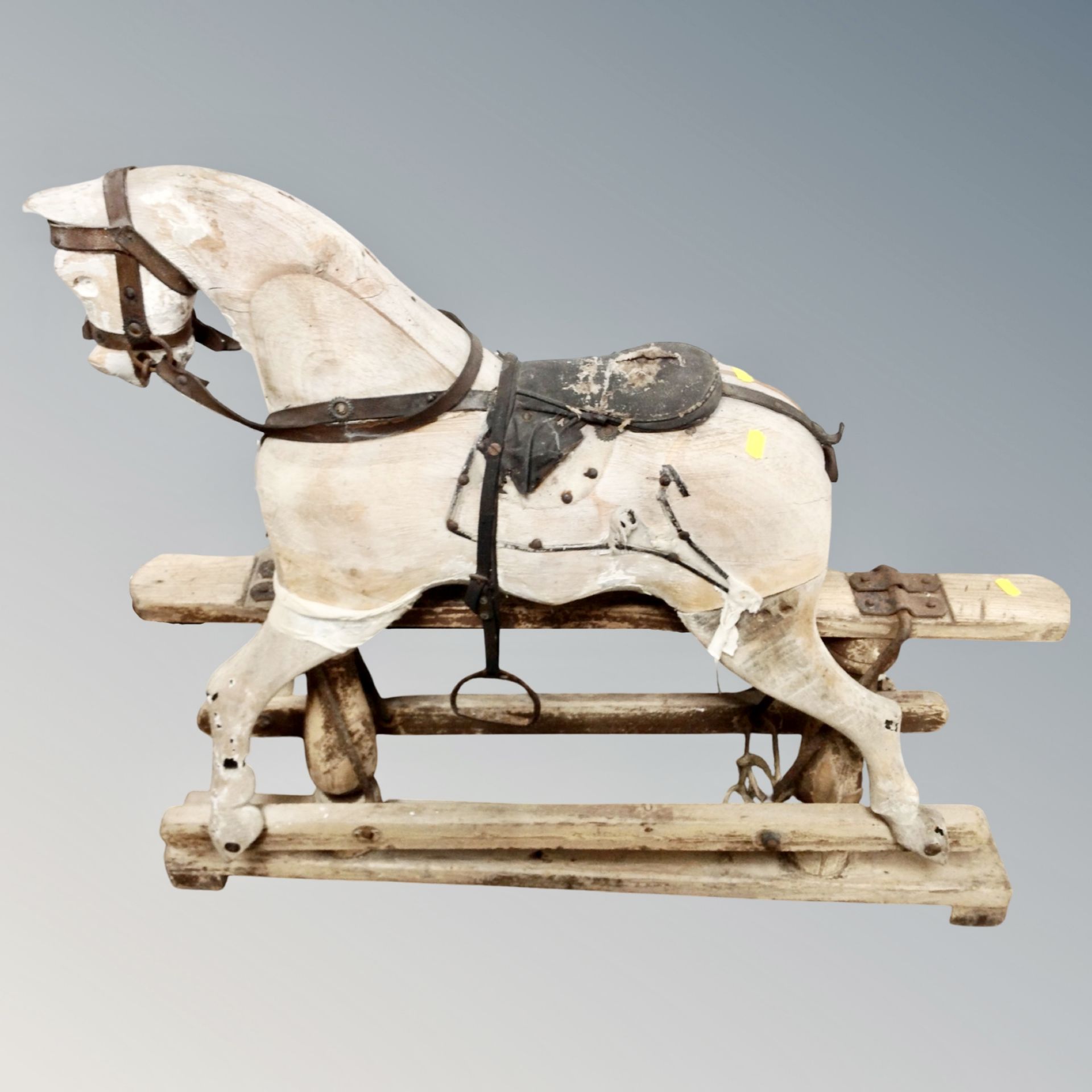 An antique wooden rocking horse, height 82 cm x length 93 cm.