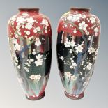 A pair of Japanese cloisonne vases decorated with blossom,