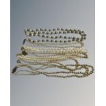 A collection of pearls and costume pearls, some with silver clasps.