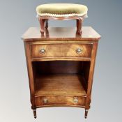 A reproduction mahogany concave side cabinet fitted with two drawers,