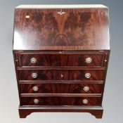 A reproduction mahogany bureau