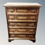 A stained beech five drawer chest