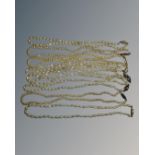 Nine strands of pearls with silver clasps.
