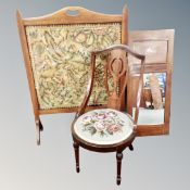 An Edwardian mahogany leather upholstered fire screen together with a beechwood nursing chair and