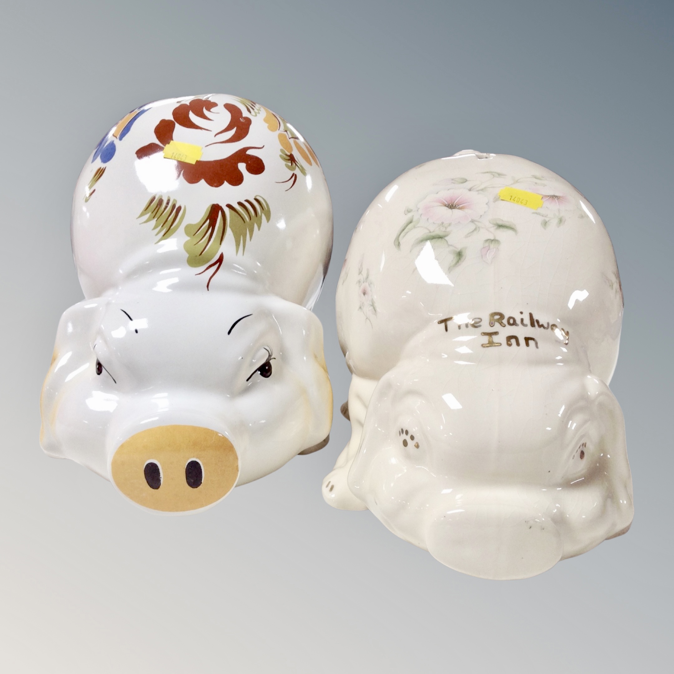 Two late 20th century oversized ceramic pig money boxes