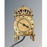 A Smiths miniature lantern clock, with electric Smiths movement, height 16.5 cm.