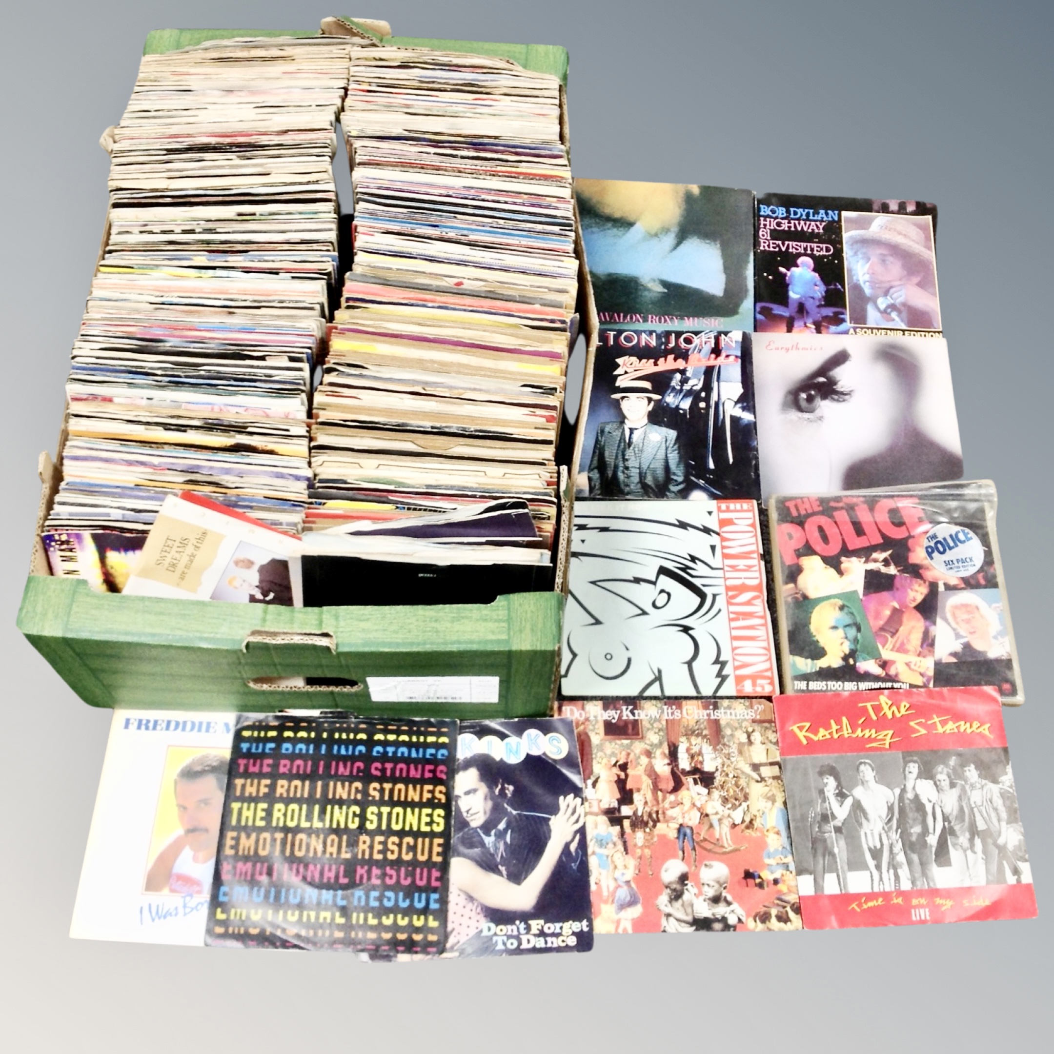 A box of large quantity of mid 20th century and later vinyl 7" singles to include Bob Dylan,