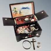 A 20th century oriental black lacquer musical jewellery box containing assorted wristwatches,