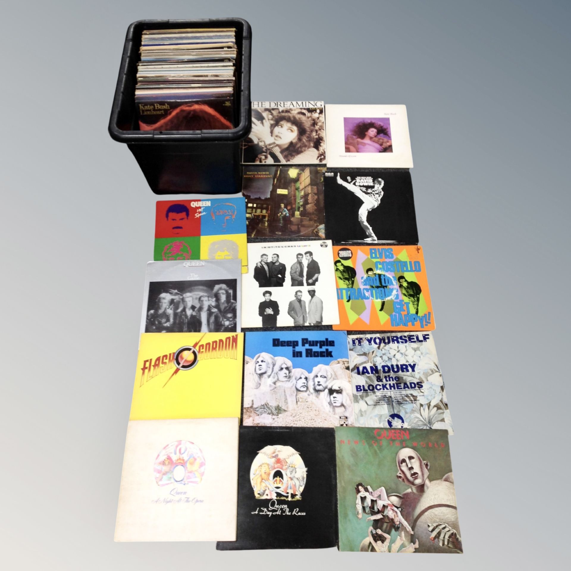 A crate of vinyl records to include Queen, Deep Purple, Ian Drury, Elvis Costello, David Bowie,