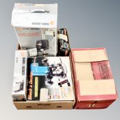 A box of Black and Decker wood worker, jigsaw, hammer drill and drill stand, all boxed,
