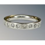 A platinum diamond half eternity ring, size H, 4.2g.