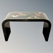 A black lacquered chinoiserie side table