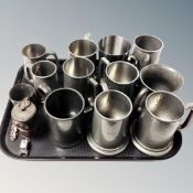 A tray of assorted pewter tankards, Premier carbide lamp,