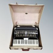 A piano accordian in case