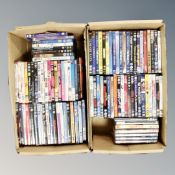 Two boxes containing approximately 100 dvds