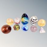 Nine assorted glass paperweights together with a crystal rock sample