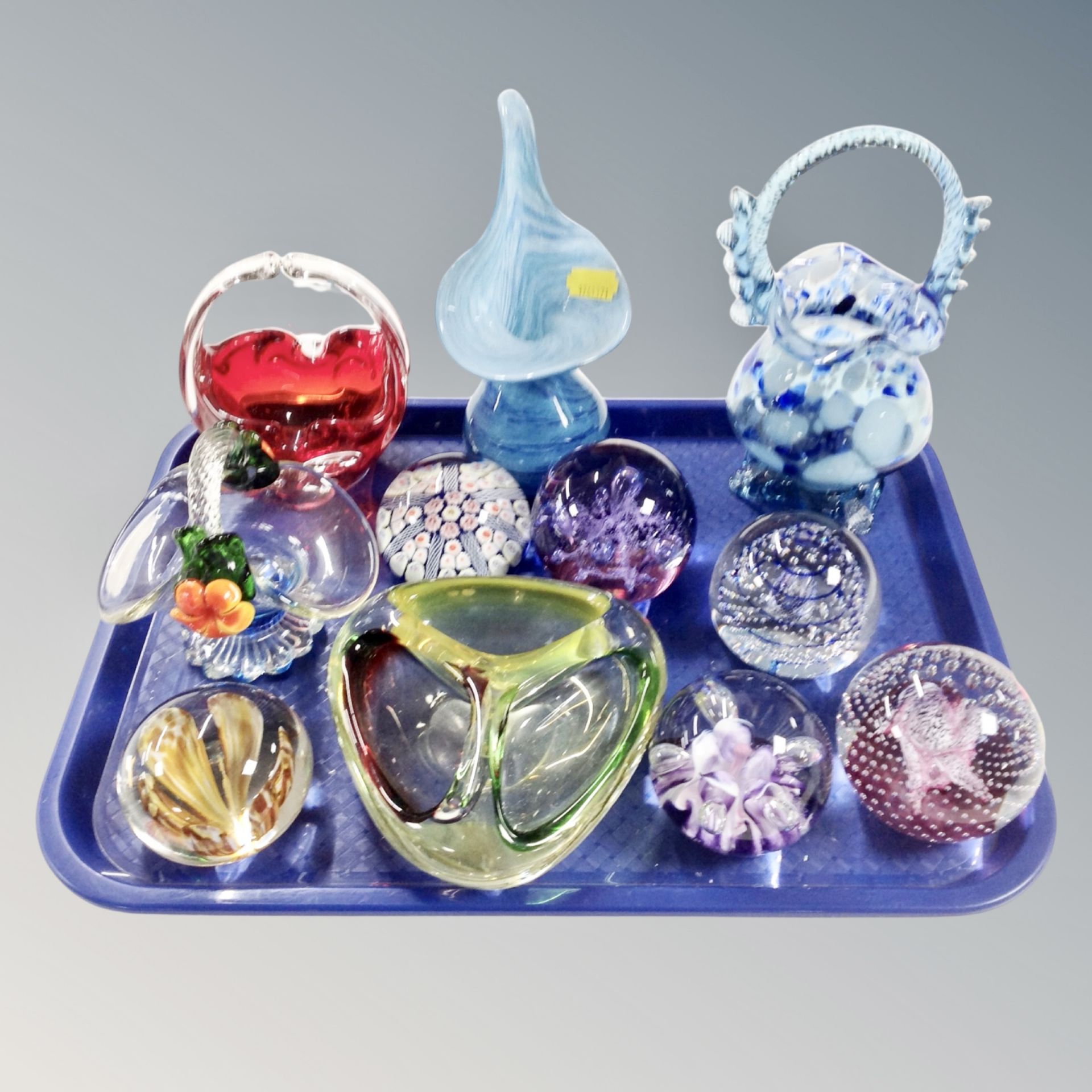 A tray of five pieces of coloured glass, Bohemian and Murano glass, six further glass paperweights,