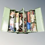 A metal concertina tool box containing hand tools