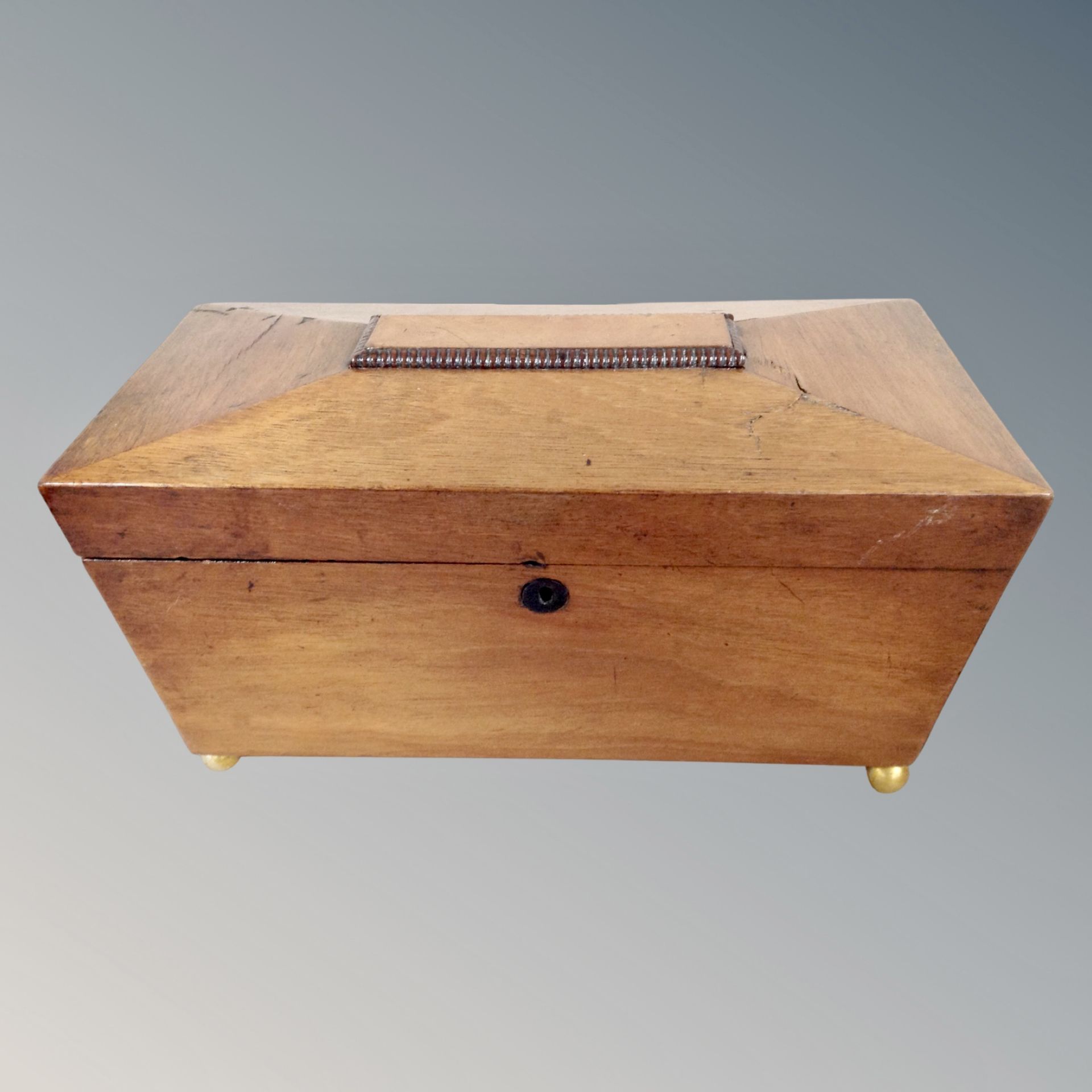 A 19th century mahogany sarcophagus tea caddy