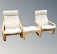 A pair of Ikea relaxer armchairs with footstool