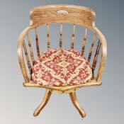 A late 19th century oak swivel desk chair
