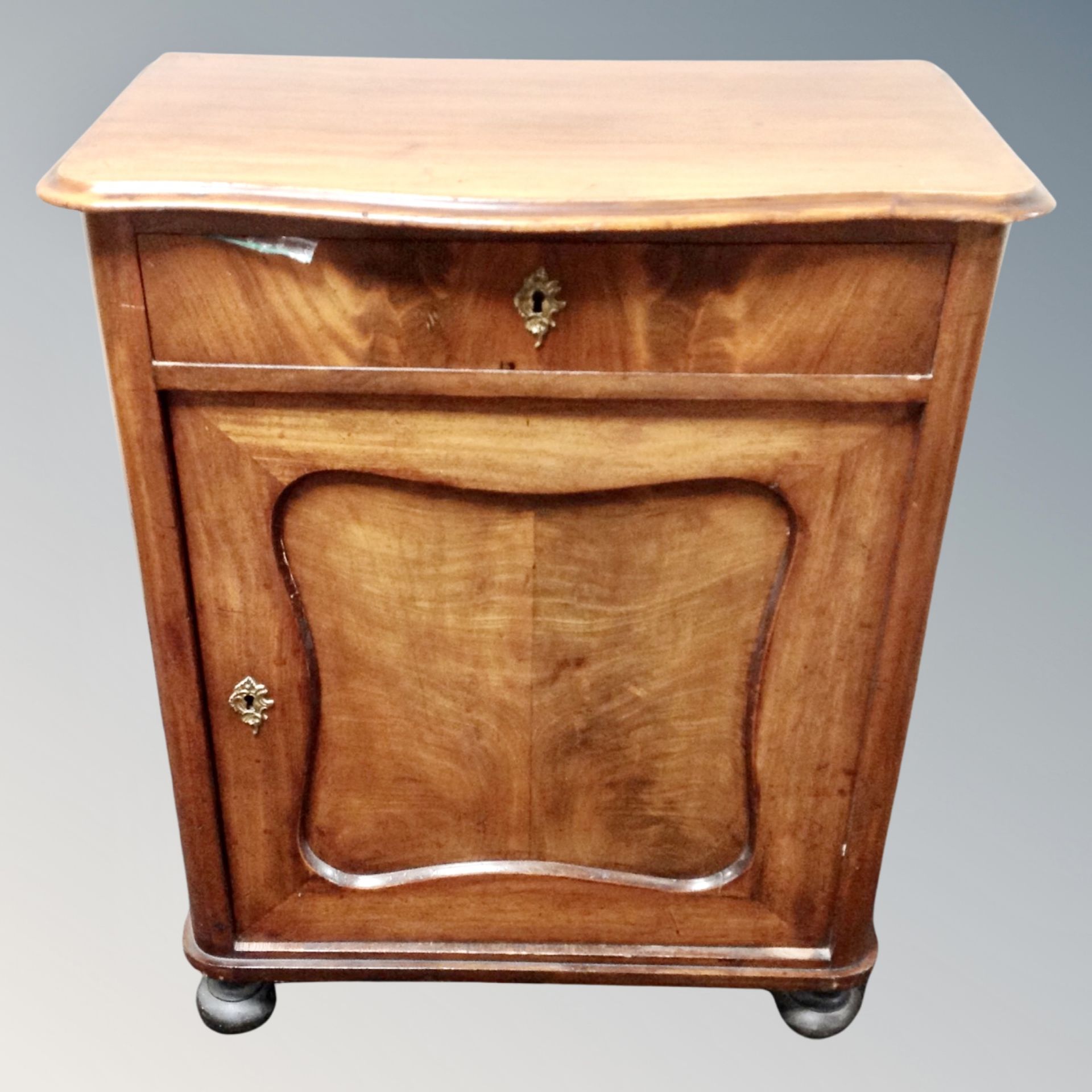A 19th century mahogany side cabinet fitted a drawer