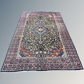 A Kirman carpet, South East Iran, 300cm by 216cm CONDITION REPORT: Thinning in areas,