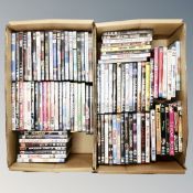 Two boxes containing approximately 100 dvds