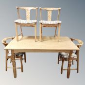 A twentieth century Danish blond oak dining table, two leaves and a set of four chairs ,