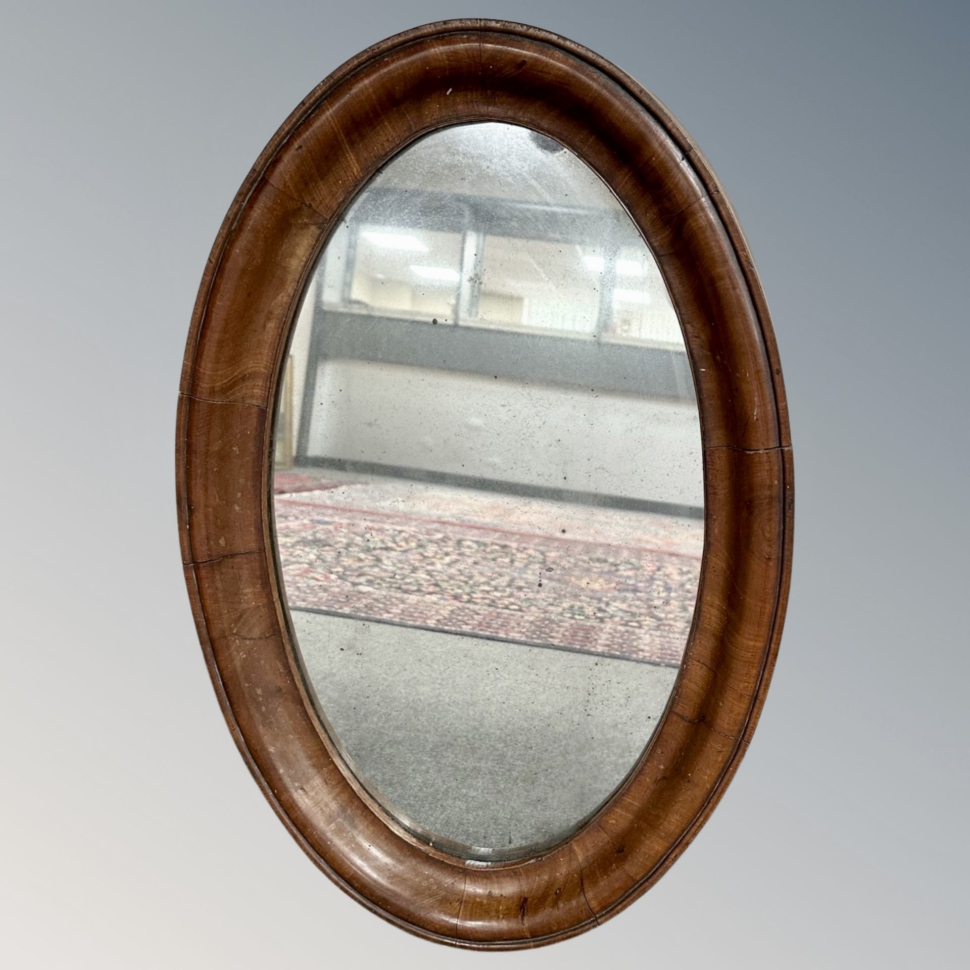 Two 19th century mahogany mirrors (oval mirror 48cm by 74cm,