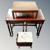 A nest of three mahogany tables with turnover top together with upholstered footstool and further