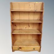 A set of antique pine waterfall bookshelves fitted a drawer