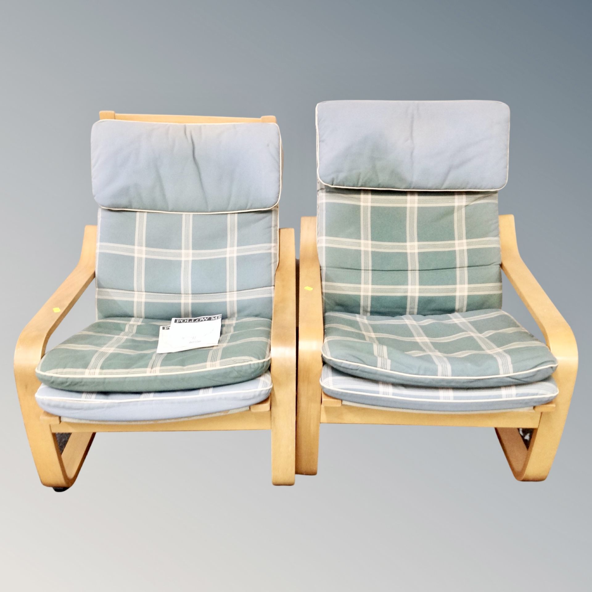 A pair of Ikea Pixbo relaxer chairs with cushions