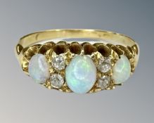 An antique 18ct gold opal and diamond ring, size N.