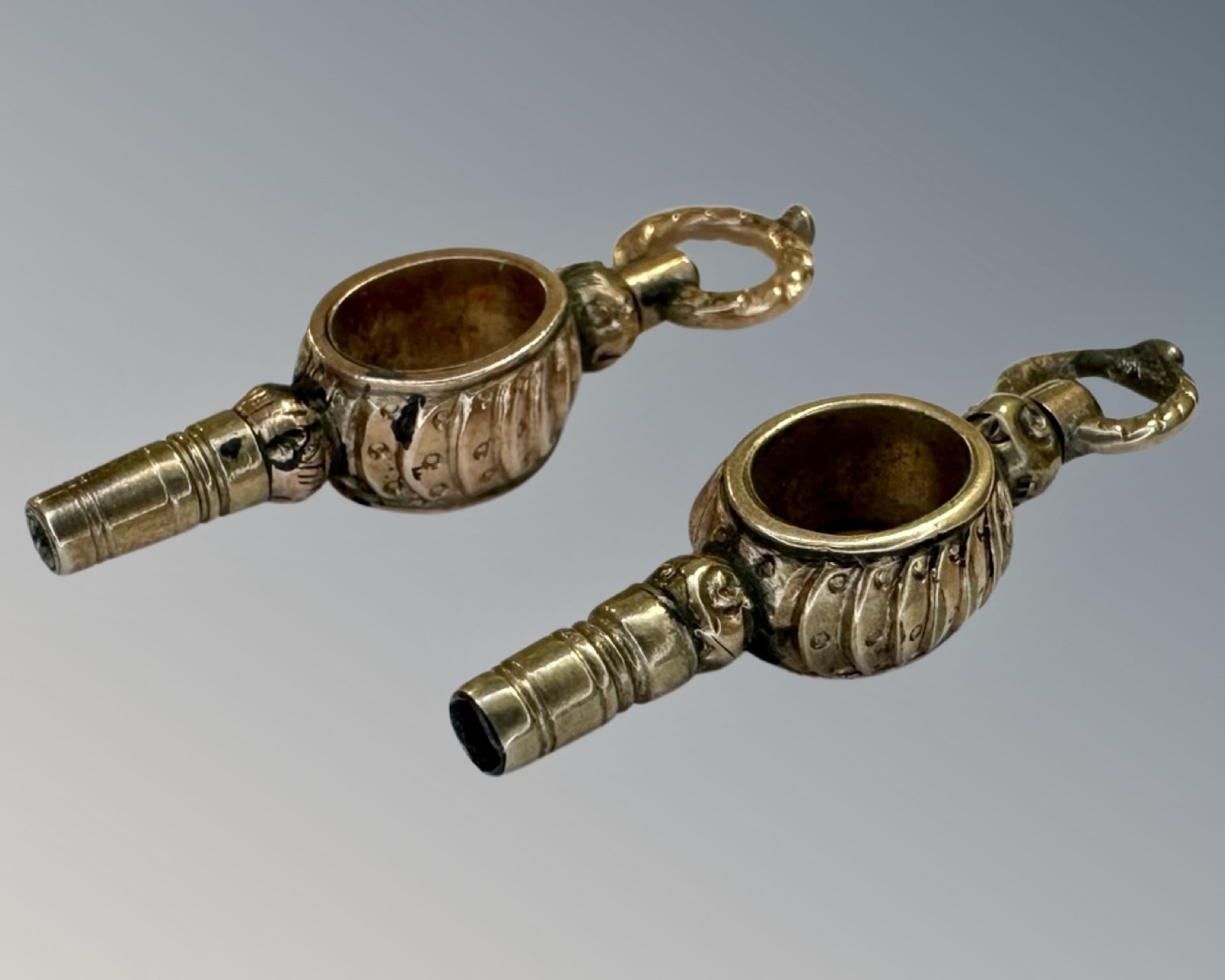 Two Georgian yellow gold pocket watch keys.