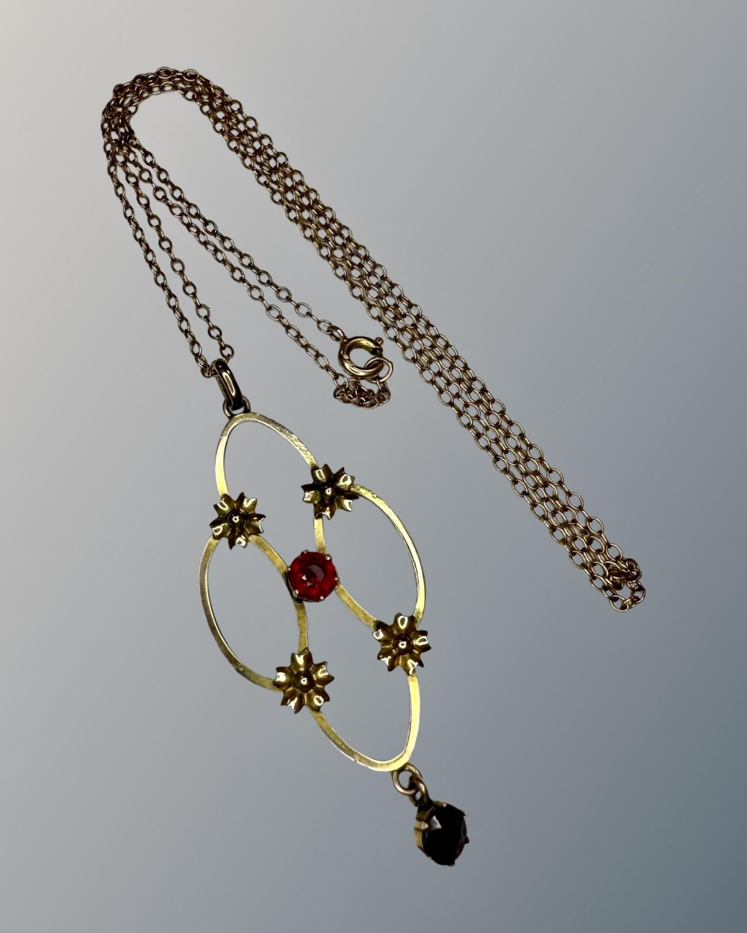 An antique yellow gold pendant on chain