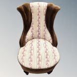 An early 20th century upholstered nursing chair