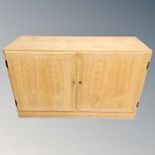 A 20th century Scandinavian oak double door low cabinet