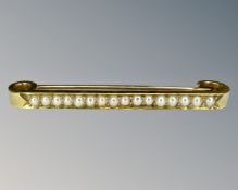 A 15ct gold pearl set bar brooch, width 4.5 cm.