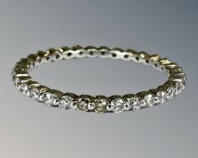 A platinum diamond full eternity ring, size J.