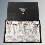 A set of six Rockingham Crystal champagne glasses, boxed.