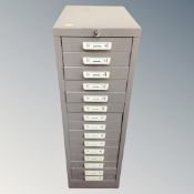 A metal fifteen drawer filing chest , height 90 cm, width 29 cm depth 42 cm.