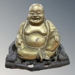 An oriental cast brass seated Buddha figure on plinth, height 12cm.