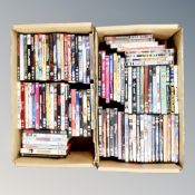 Two boxes containing approximately 100 dvds